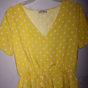 A a yellow blouse with white polka dots